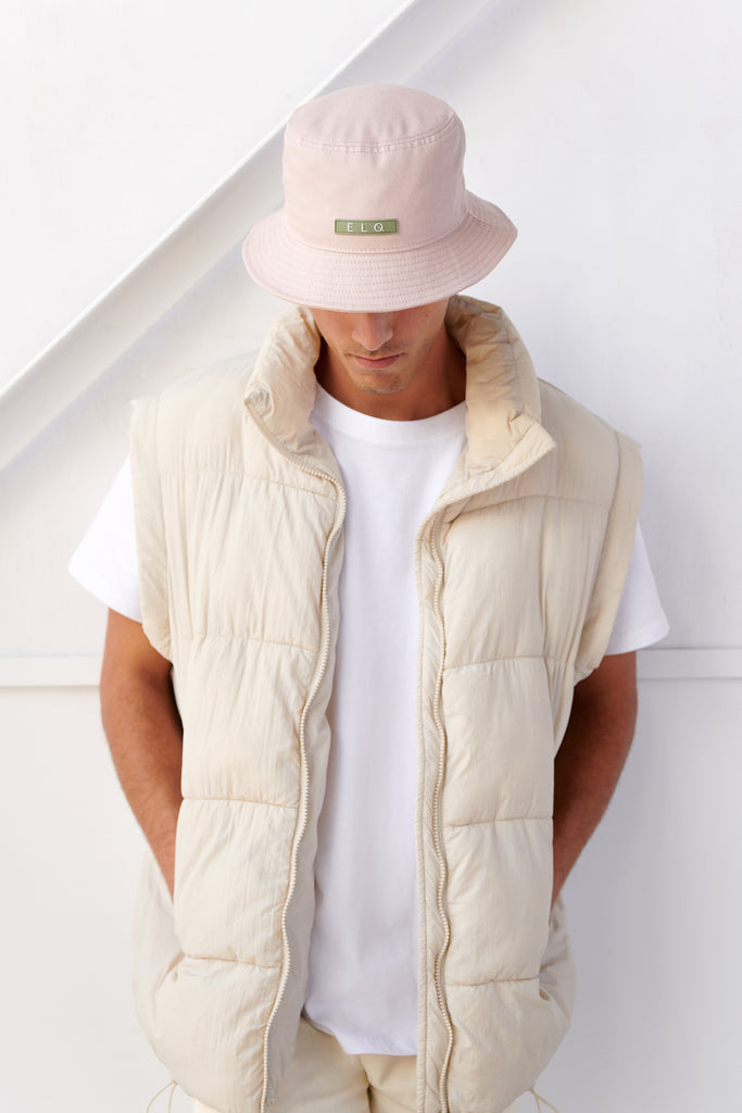 Male model wearing dusty pink cotton bucket hat