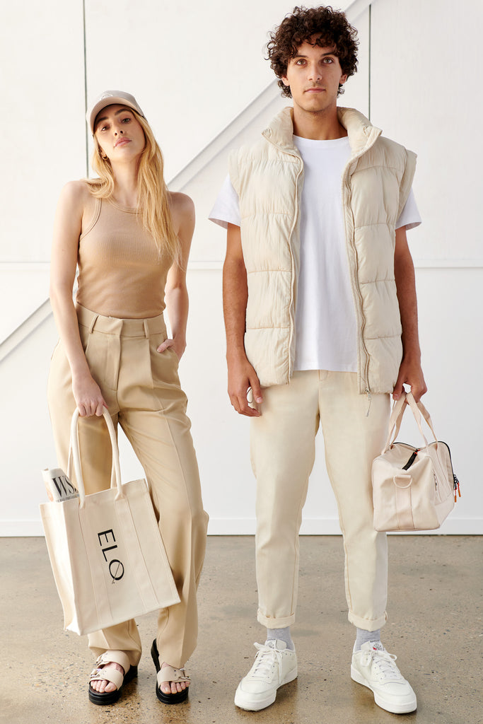 Models wearing all beige outfits, carrying ELQ canvas tote bag and crossbody bag