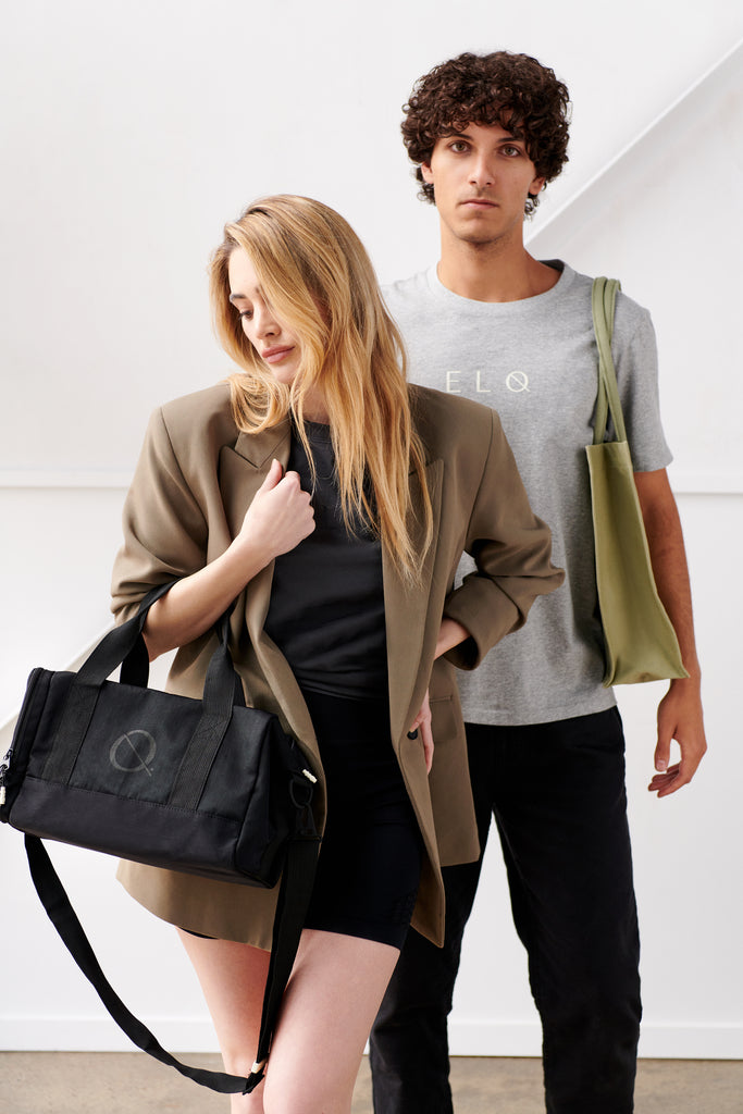 Streetwear aesthetic fashion. Models wearing black crossbody duffle bag, khaki green mens tote bag,