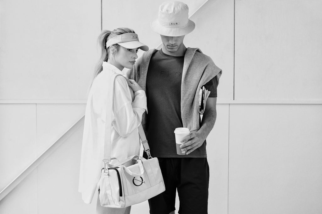 Models wearing essential clothing, Signature visor hat, cotton bucket hat and small crossbody bag