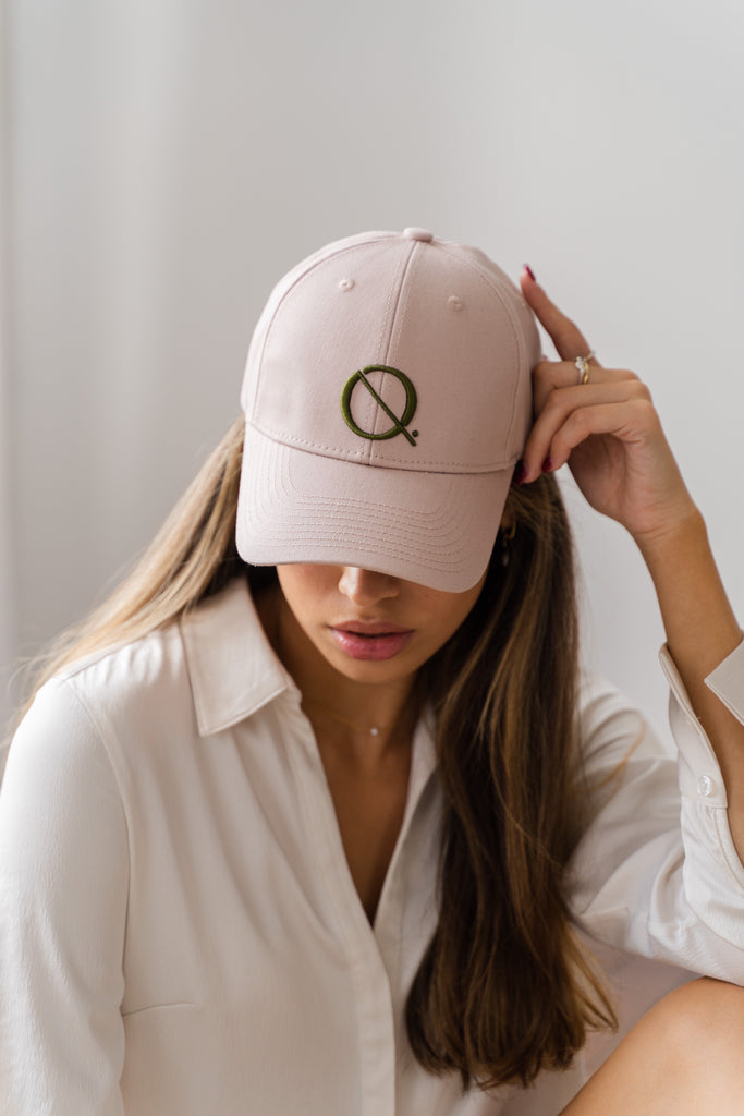 Model wearing ELQ Active Icon dusty pink cap