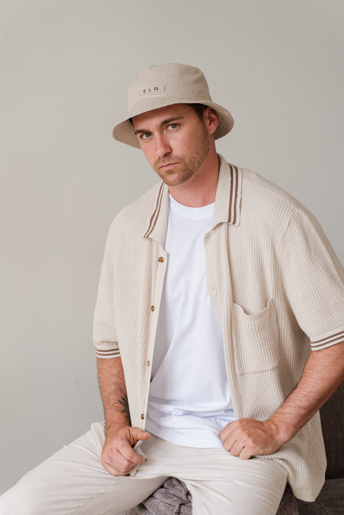 Male model wearing ELQ Active Oat Beige Bucket Hat